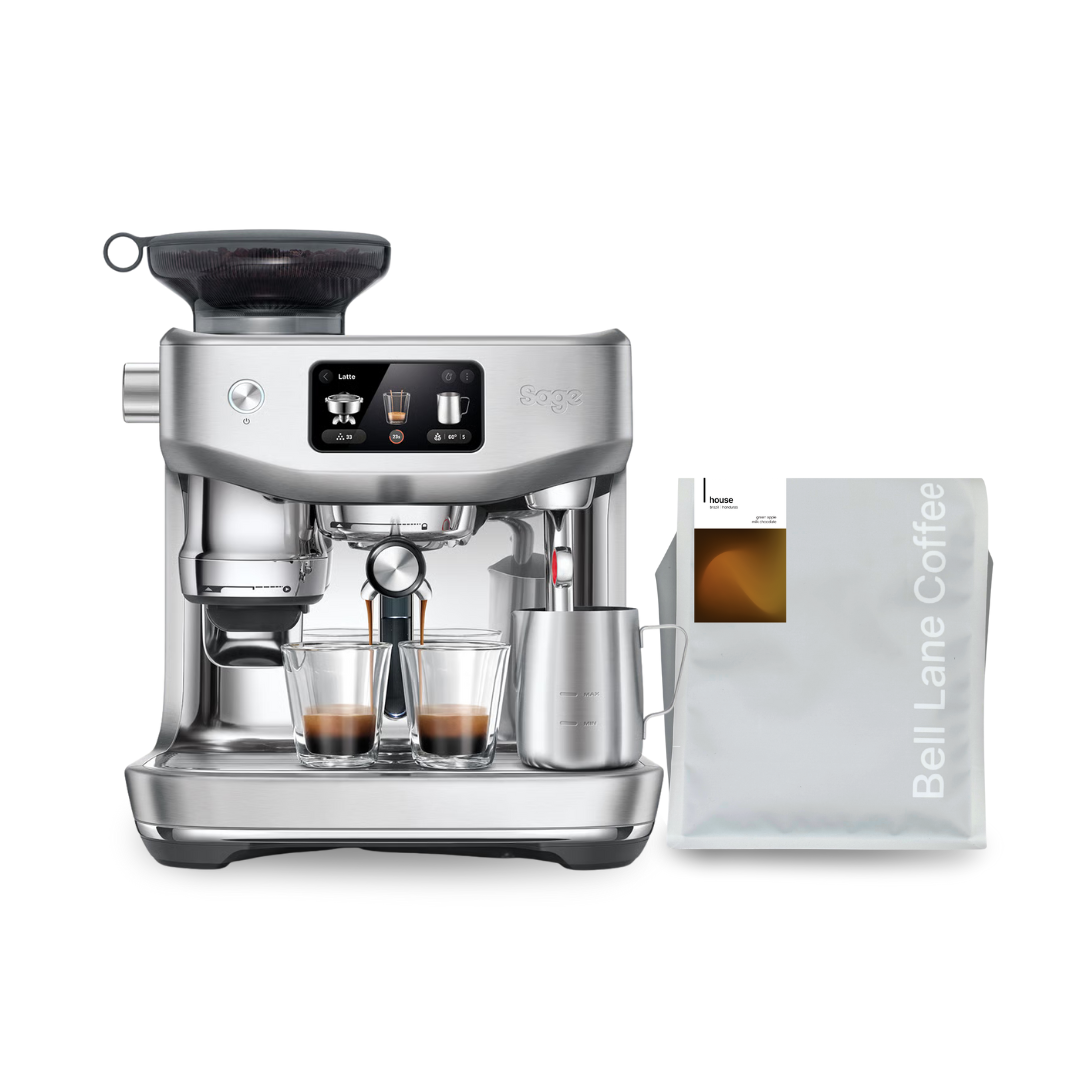 Silver espresso machine with two cups of coffee and a package of Bell Lane Coffee on a white background