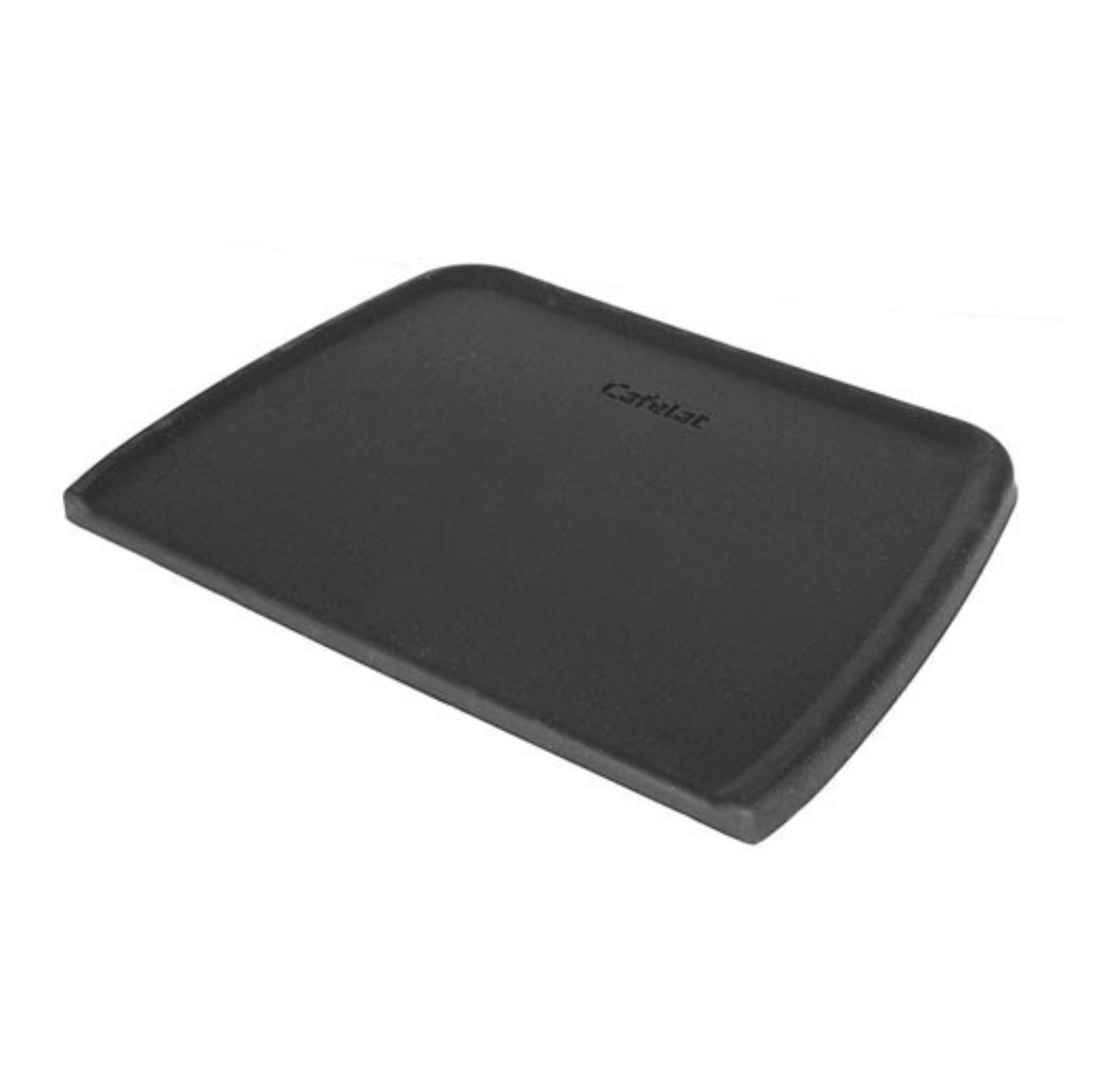 A black Cafelat tamping mat made of durable rubber. The mat has a rectangular shape with slightly raised edges and a subtle curve on one side, designed to protect countertops during espresso tamping. Photographed against a plain white background.