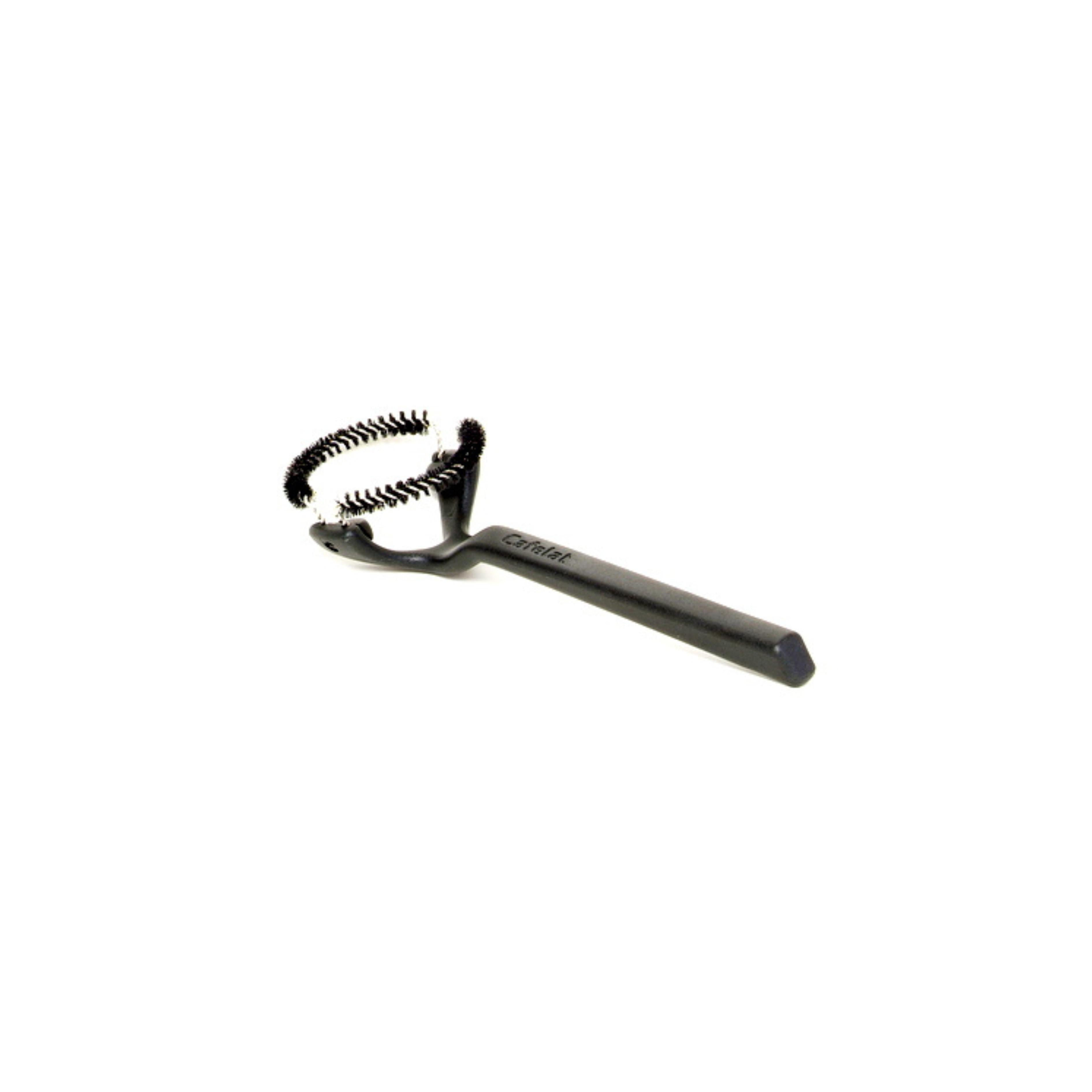 A black group head cleaning brush with a curved handle and circular bristle design. The brush features stiff, coiled bristles arranged in a ring to clean the group head of an espresso machine. The brand name “Cafelat” is embossed on the handle. The tool is photographed against a plain white background.